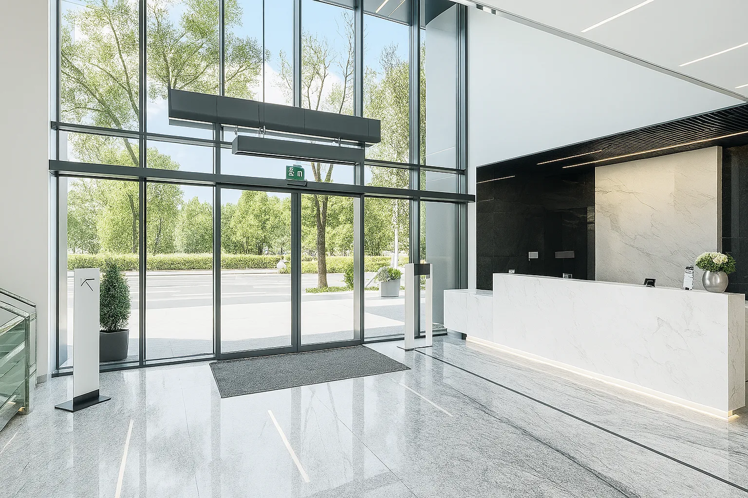 Puerta automática corrediza de cristal en recepción corporativa.